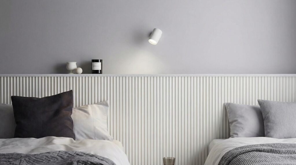 Fluted wall panel behind a bed